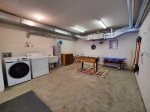 Washer and Dryer with Foosball Table in Garage